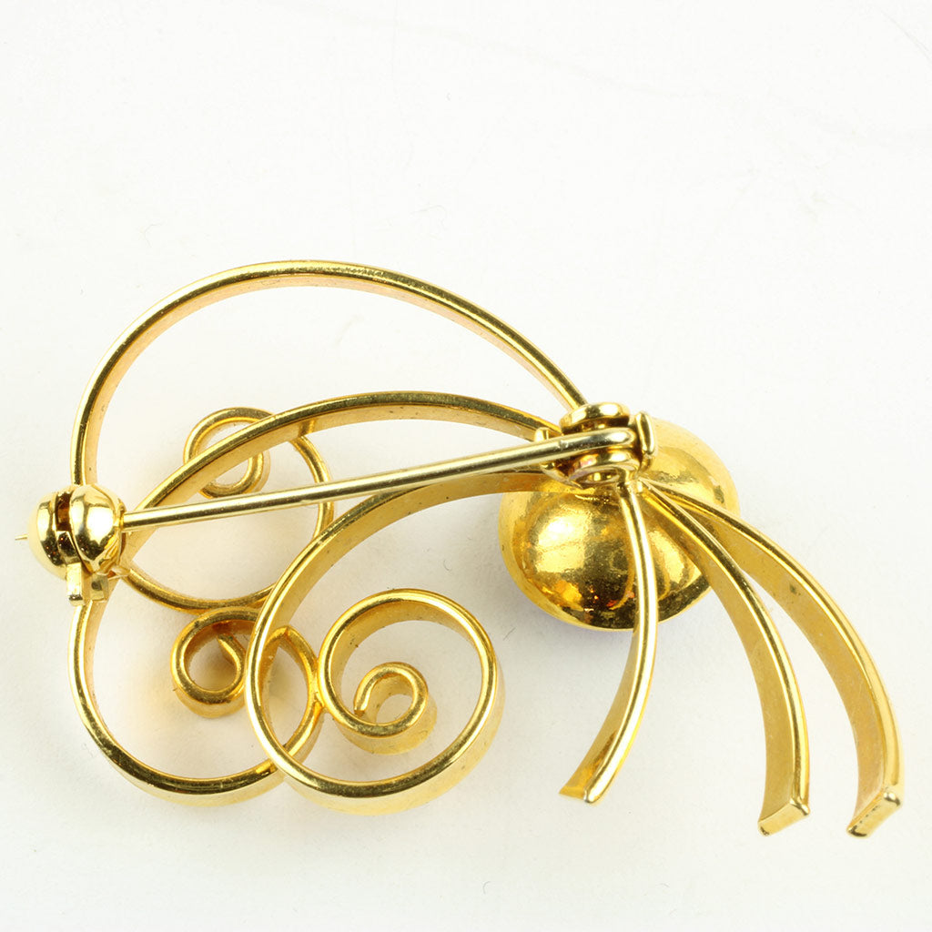 Broche af gulddouble med lilla flus