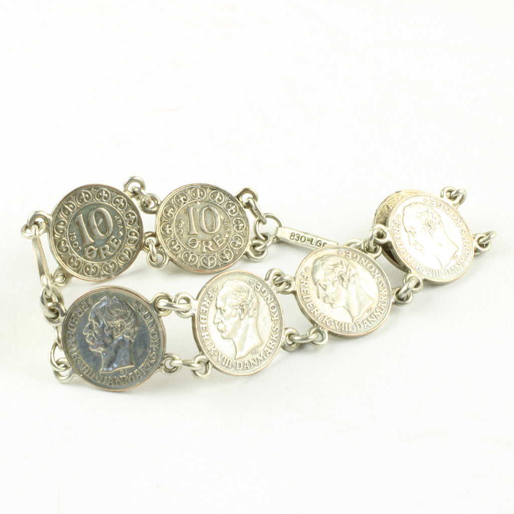 Armbånd bestående af otte ti øre dateret 1907