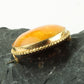 Broche af rav og forgyldt metal