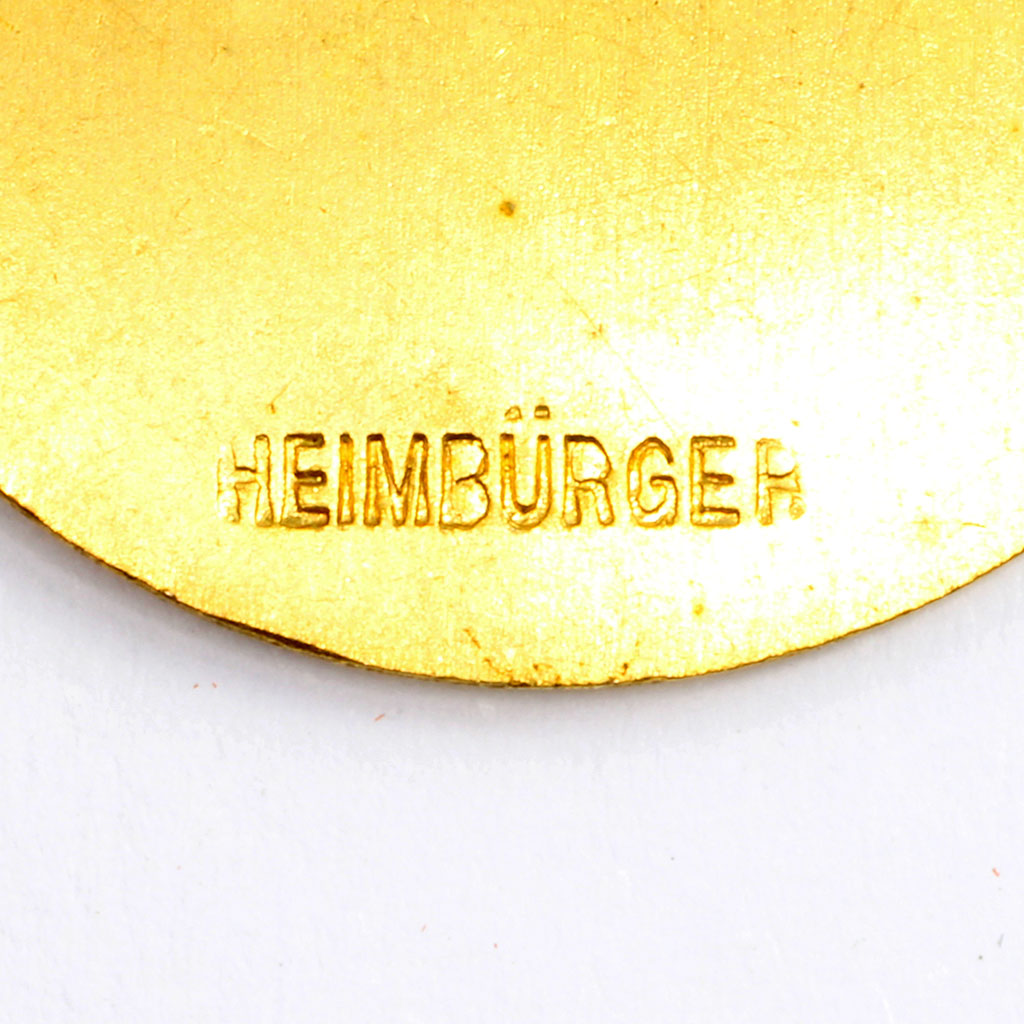 Lille medalje fremstillet hos HEIMBÜRGER prydet med lyre